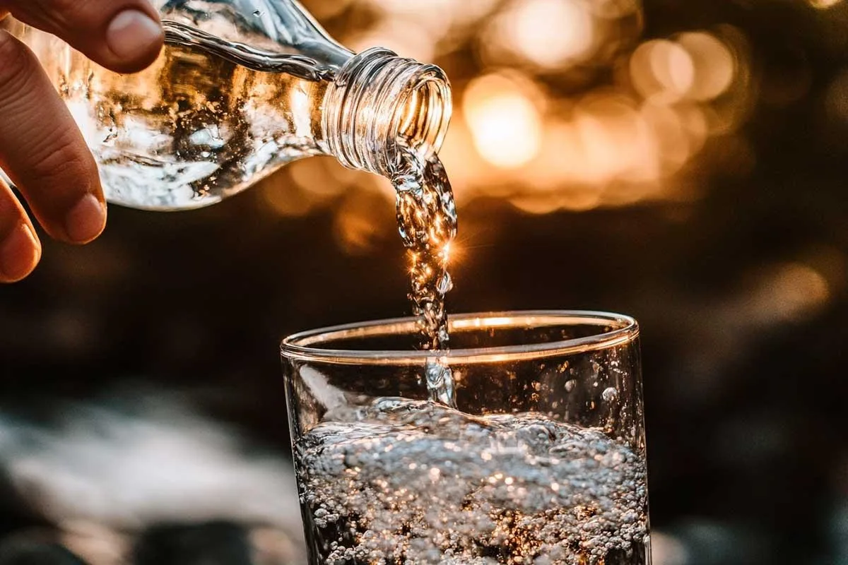 A glass of water representing daily hydration habits